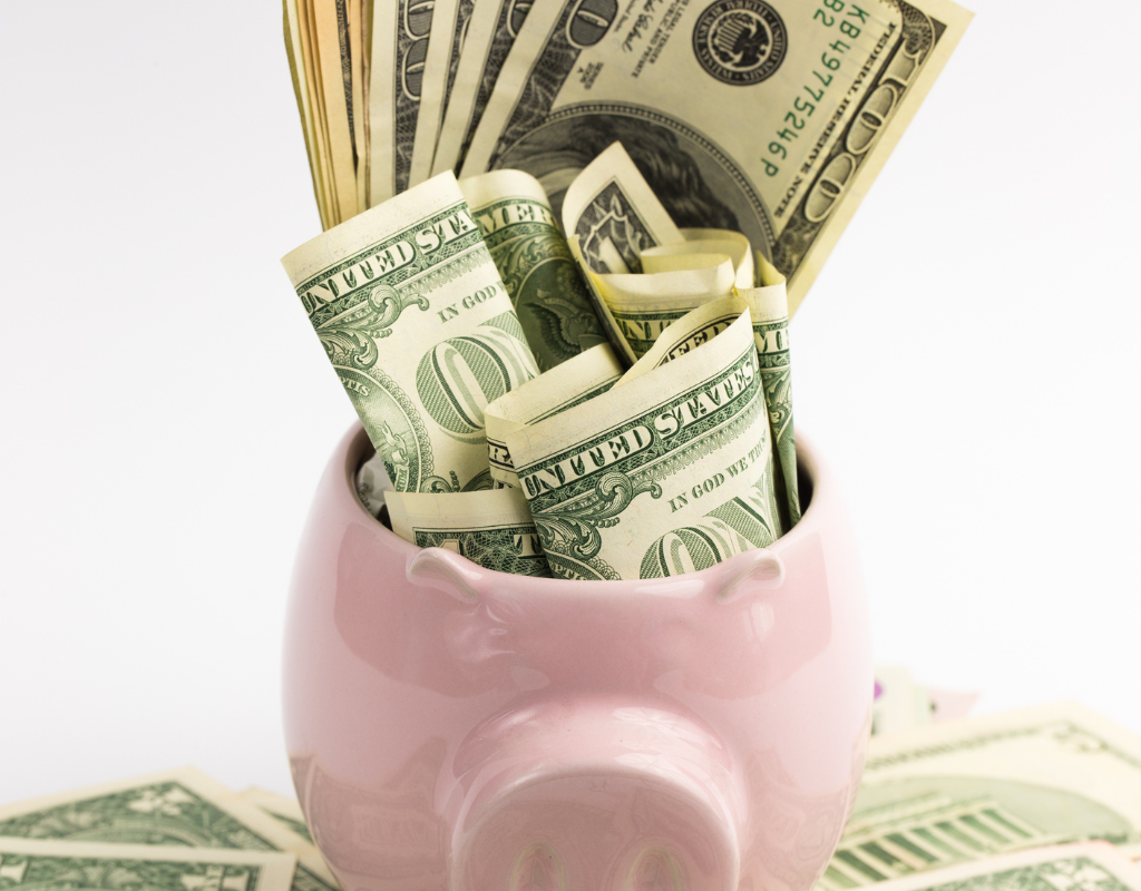 Saving money in a piggy bank