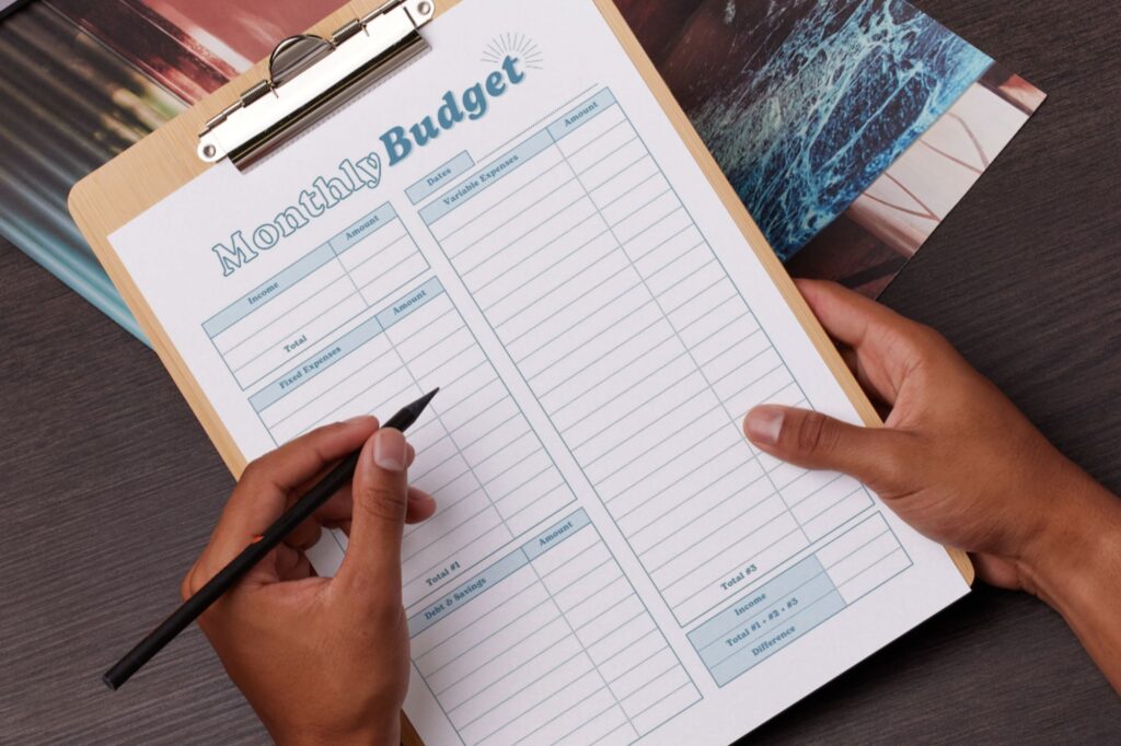 Monthly budget page on clipboard